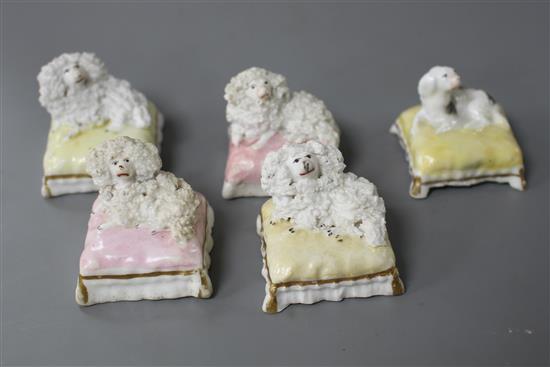 Five Staffordshire porcelain toy figures of four poodles and a King Charles spaniel recumbent on a cushion, c.1840-50, W. 3.8cm